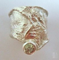 Sterling Silver Wide Sheath Ring with Peridot by Andrea Russell at The Avenue Gallery, a contemporary fine art gallery in Victoria, BC, Canada.