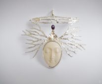 White carved bone and amethyst Shakti Pendant by Andrea Russell at The Avenue Gallery, a contemporary fine art gallery in Victoria, BC, Canada.