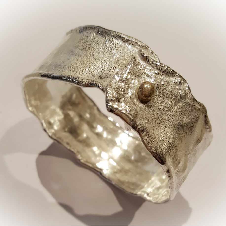 Reticulated Silver Bangle with Gold Ball by Barbara Adams at The Avenue Gallery, a contemporary fine art gallery in Victoria, BC, Canada.
