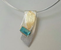 Wave Brooch / Pendant by Andrea Roberts at The Avenue Gallery, a contemporary art gallery in Victoria BC, Canada.