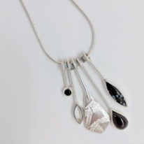Garnet, Snowflake Obsidian and Onyx Dangly Necklace by Brenda Roy at The Avenue Gallery, a contemporary fine art gallery in Victoria, BC, Canada.