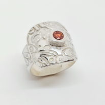 Textured Silver Ring with Red Cubic Zirconia by Veronica Stewart at The Avenue Gallery, a contemporary fine art gallery in Victoria, BC, Canada.