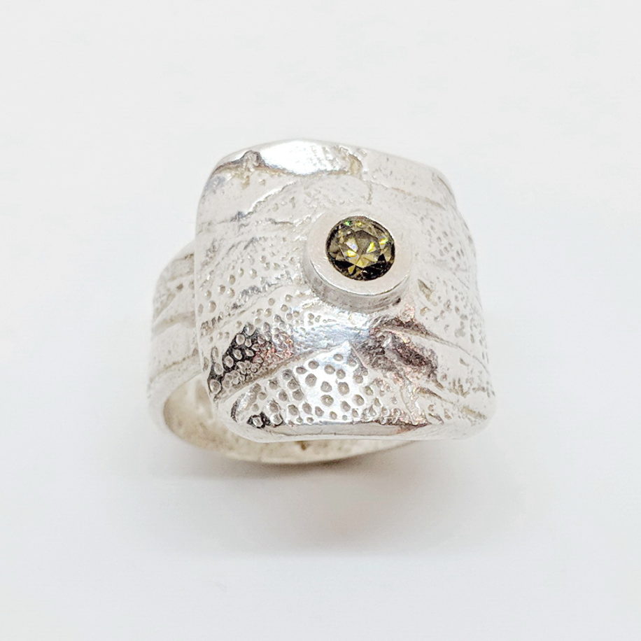 Textured Silver Ring with Topaz Cubic Zirconia by Veronica Stewart at The Avenue Gallery, a contemporary fine art gallery in Victoria, BC, Canada.