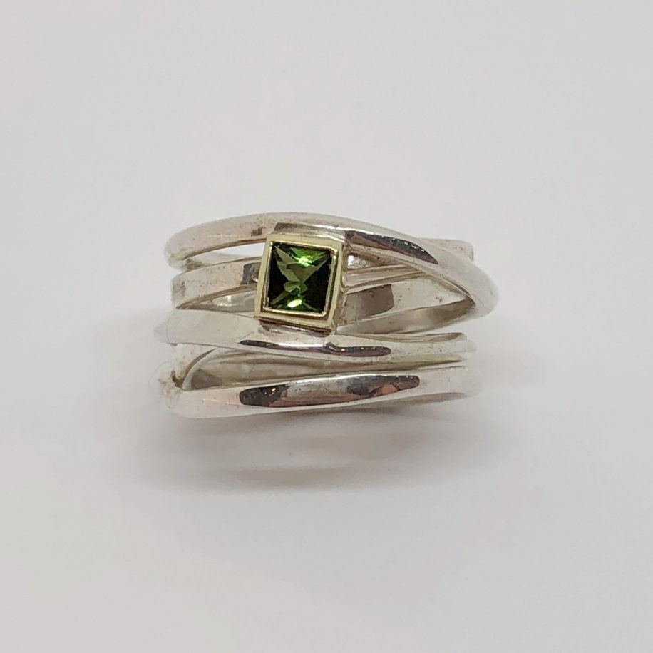 Sterling Silver OneFooter Ring with Green Tourmaline set in 18kt. Yellow Gold by Dorothée Rosen at The Avenue Gallery, a contemporary fine art gallery in Victoria, BC, Canada.