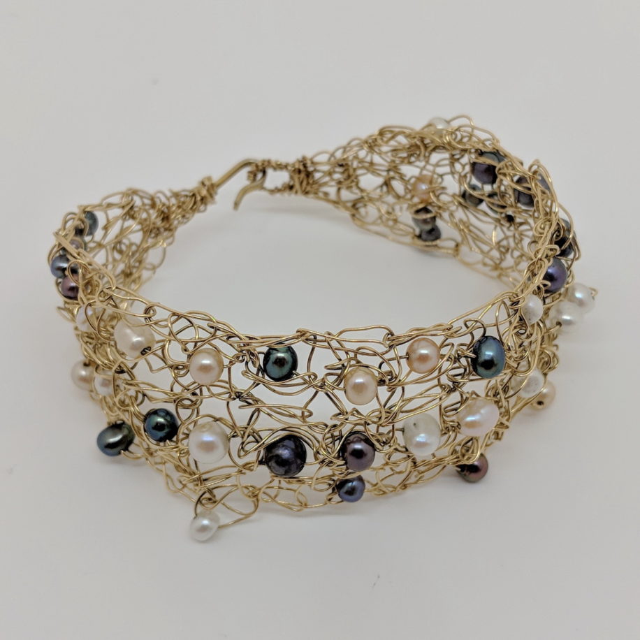 Gold-Fill Crocheted Wire Bracelet with Pearls by Veronica Stewart at The Avenue Gallery, a contemporary fine art gallery in Victoria, BC, Canada.