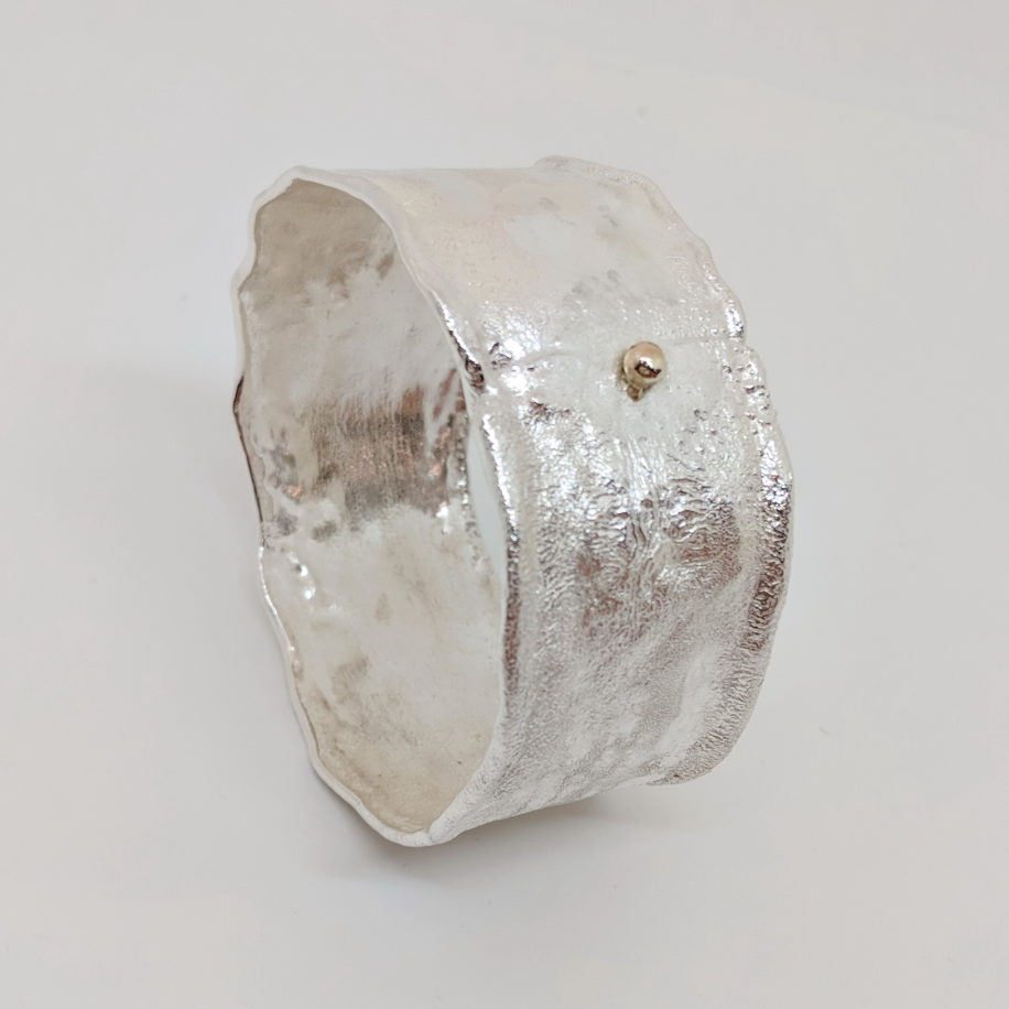 Reticulated Silver Bangle with Gold Ball by Barbara Adams at The Avenue Gallery, a contemporary fine art gallery in Victoria, BC, Canada.