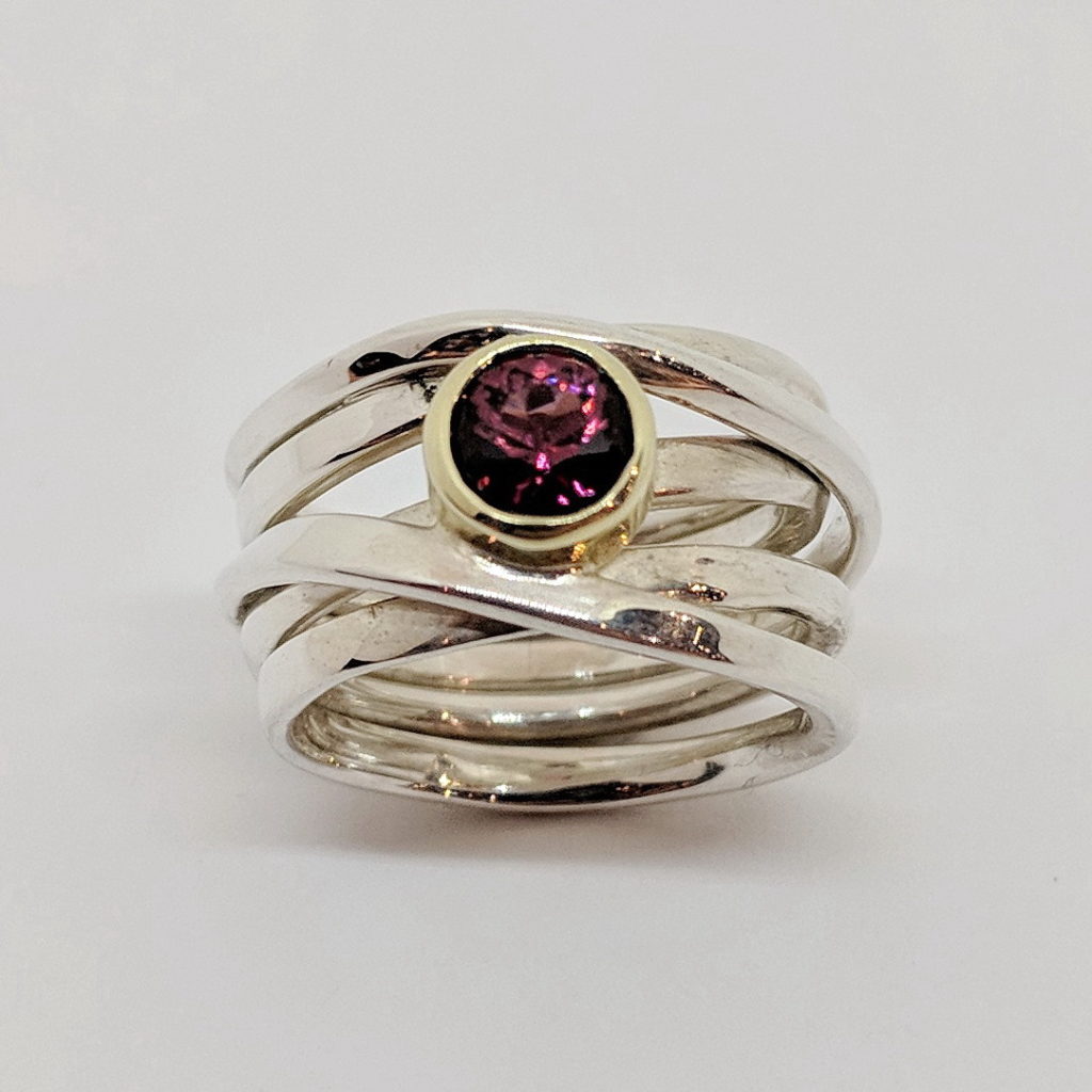Sterling Silver OneFooter Ring with Pyrope Garnet by Dorothée Rosen at The Avenue Gallery, a contemporary fine art gallery in Victoria, BC, Canada.