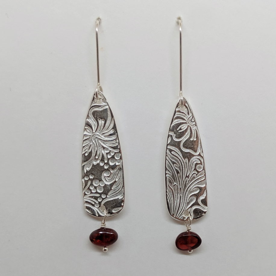 Large Textured Shield Earrings with Garnet by Veronica Stewart at The Avenue Gallery, a contemporary fine art gallery in Victoria, BC, Canada.