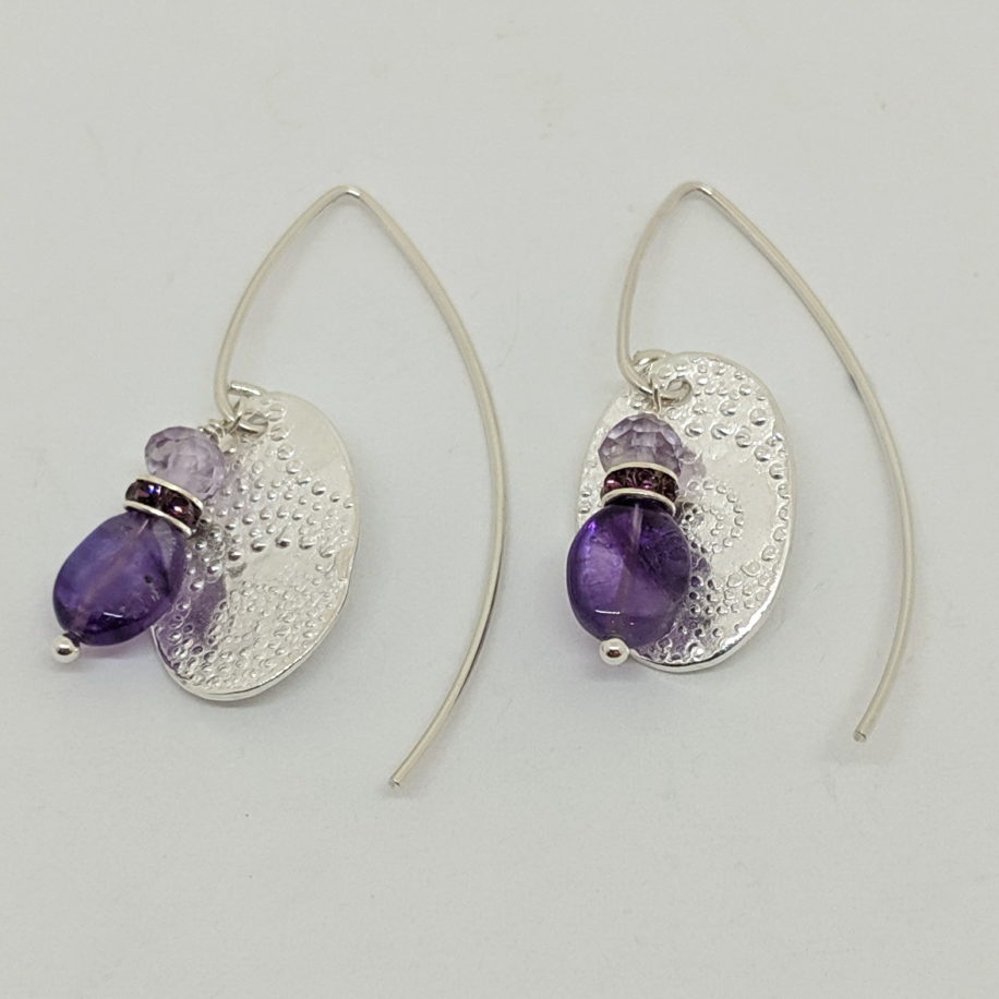 Medium Textured Oval Earrings with Amethyst by Veronica Stewart at The Avenue Gallery, a contemporary fine art gallery in Victoria, BC, Canada.