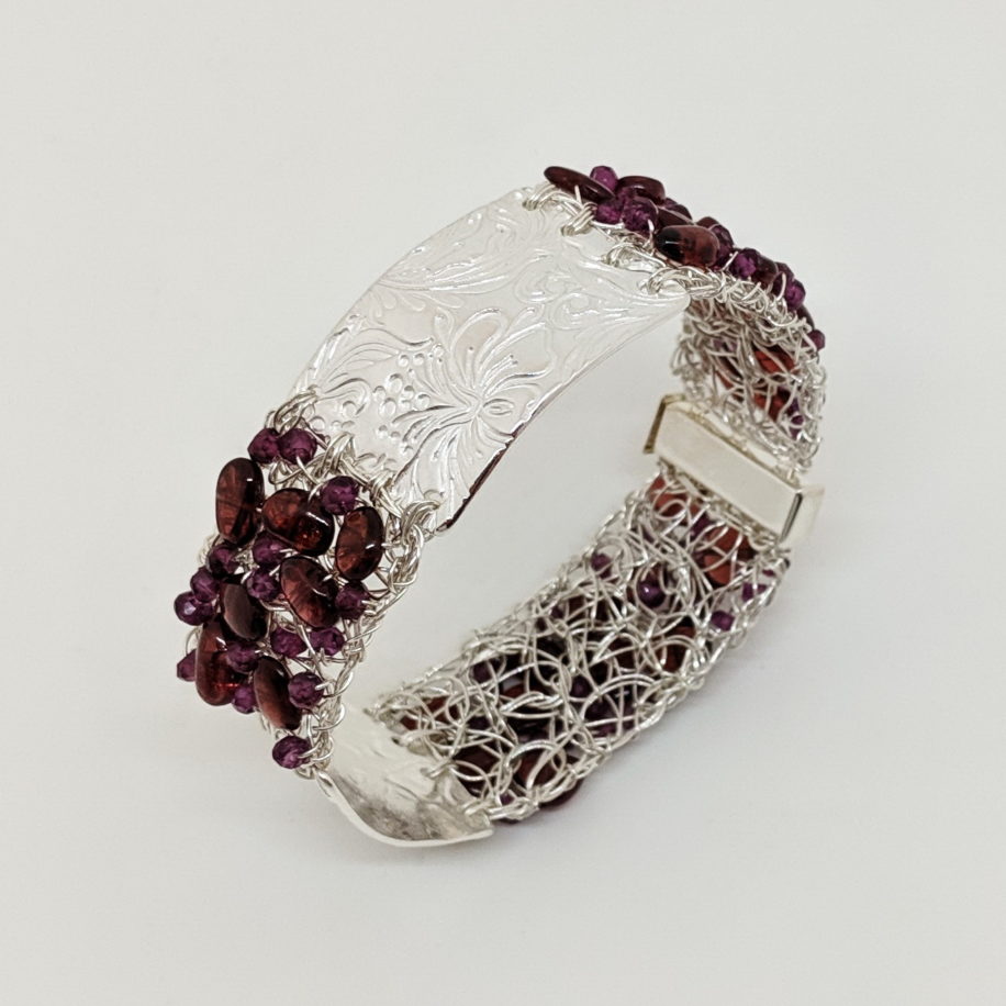 Silver Textured & Crochet Fine Silver Wire Cuff with Garnets by Veronica Stewart at The Avenue Gallery, a contemporary fine art gallery in Victoria, BC, Canada.