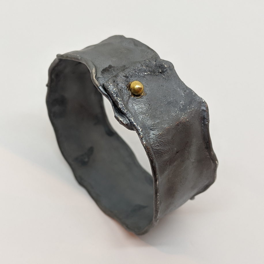 Wide Oxidized Silver Bangle with Gold Ball by Barbara Adams at The Avenue Gallery, a contemporary fine art gallery in Victoria, BC, Canada.