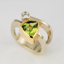 White & Peach Gold Ring with Peridot by Bayot Heer at The Avenue Gallery, a contemporary fine art gallery in Victoria, BC, Canada.