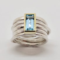 Onefooter Ring in Sterling Silver with 10 X 5mm Swiss Blue Topaz by Dorothée Rosen at The Avenue Gallery, a contemporary fine art gallery in Victoria, BC, Canada.