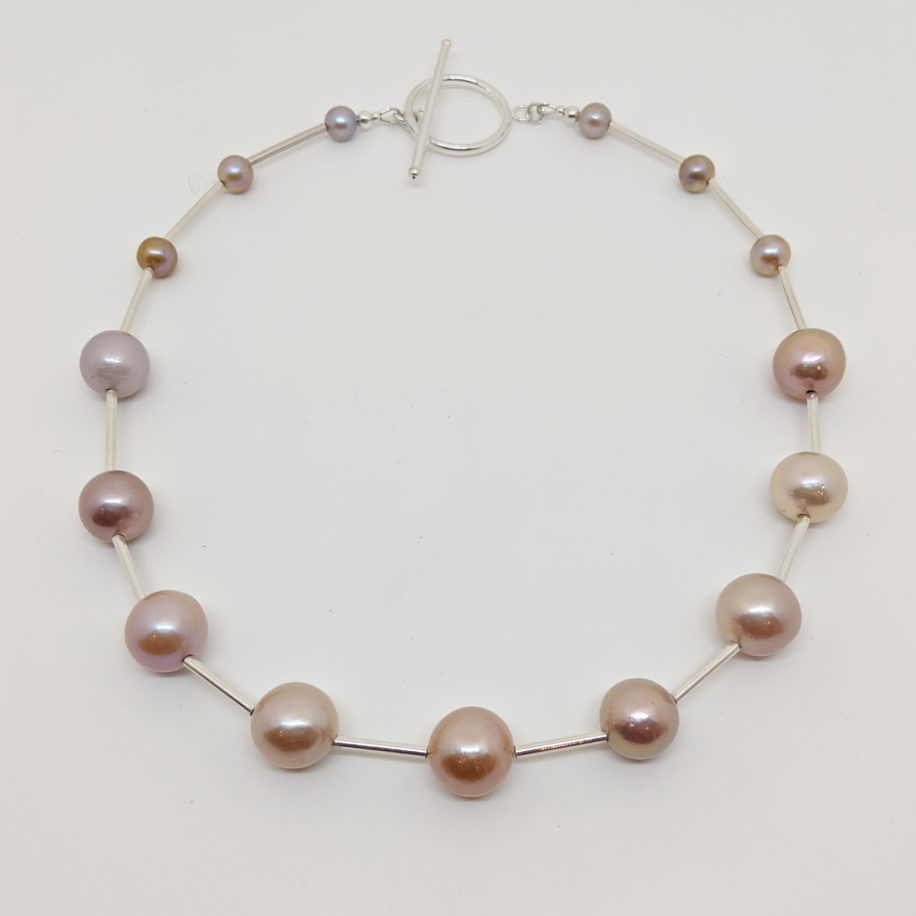 Pink Freshwater Pearl Necklace with Sterling Silver Bears & Clasp by Val Nunns at The Avenue Gallery, a contemporary fine art gallery in Victoria, BC, Canada.