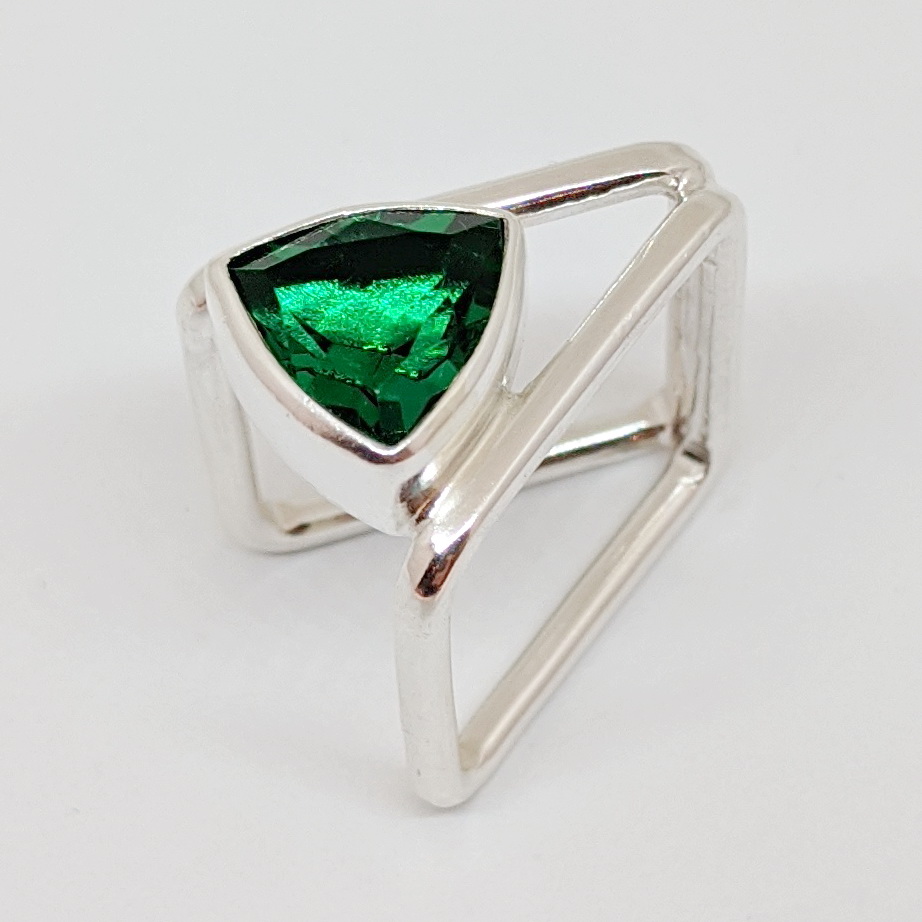 Trillion Cut Green Topaz Book Ring by A & R Jewellery at The Avenue Gallery, a contemporary fine art gallery in Victoria, BC, Canada.