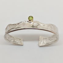 Silver, Gold & Peridot Cuff Bracelet by Andrea Russell at The Avenue Gallery, a contemporary fine art gallery in Victoria, BC, Canada.