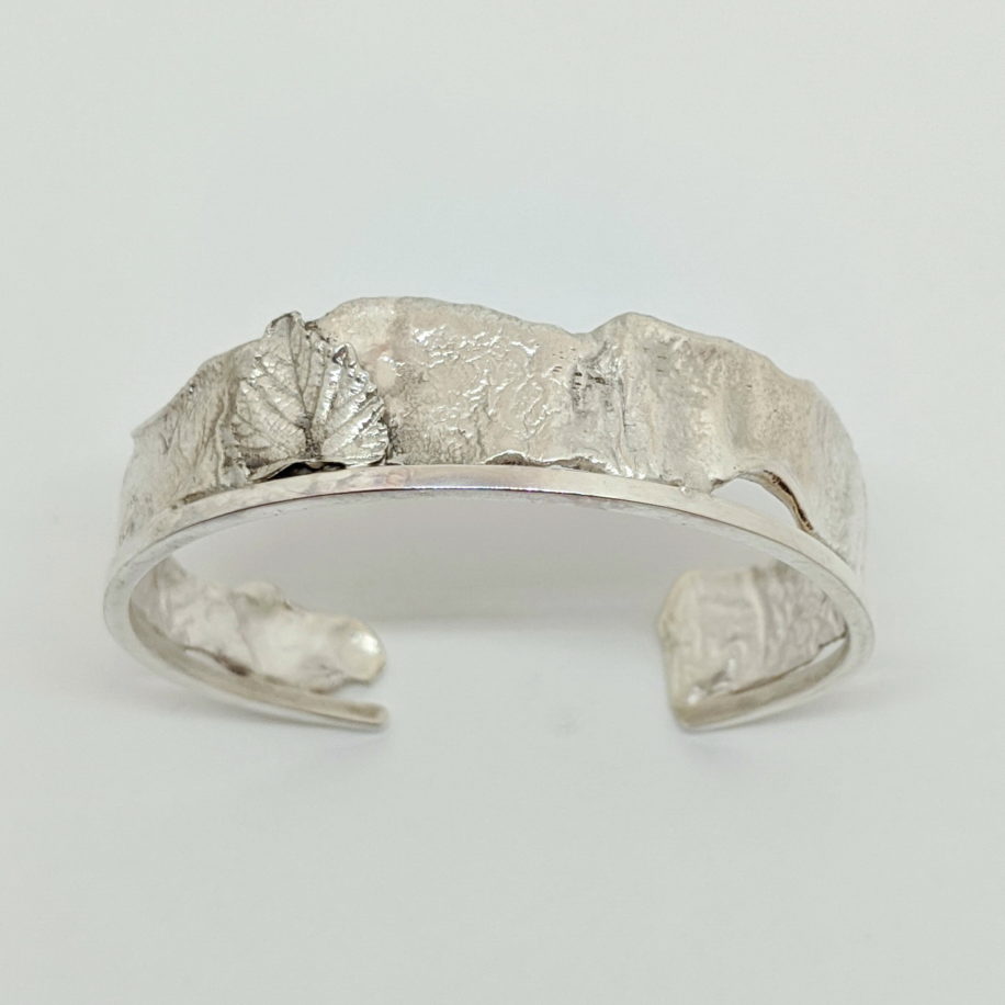 Silver Cuff Bracelet with Cast Leaf by Andrea Russell at The Avenue Gallery, a contemporary fine art gallery in Victoria, BC, Canada.