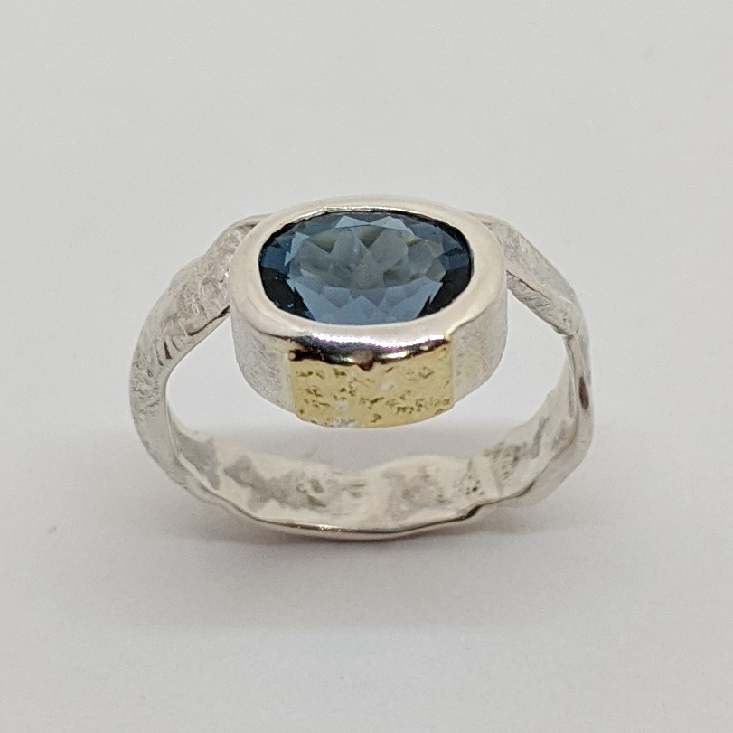 Silver, 18kt. Gold & London Blue Topaz Ring by Andrea Russell at The Avenue Gallery, a contemporary fine art gallery in Victoria, BC, Canada.