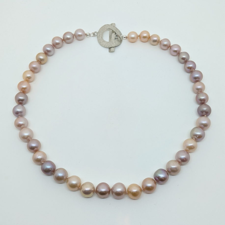 Edison Pearl Necklace with Large Sterling Silver Hammered Clasp by Val Nunns at The Avenue Gallery, a contemporary fine art gallery in Victoria, BC, Canada.