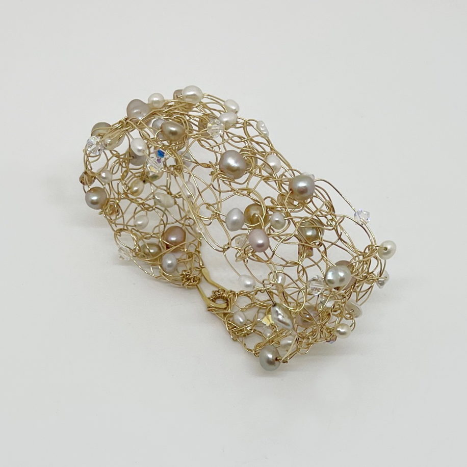 Crochet Gold-Fill Wire Cuff with Freshwater Pearls & Swarovski Crystals by Veronica Stewart at The Avenue Gallery, a contemporary fine art gallery in Victoria, BC, Canada.