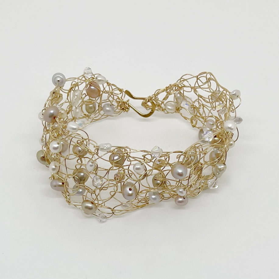 Crochet Gold-Fill Wire Cuff with Freshwater Pearls & Swarovski Crystals by Veronica Stewart at The Avenue Gallery, a contemporary fine art gallery in Victoria, BC, Canada.