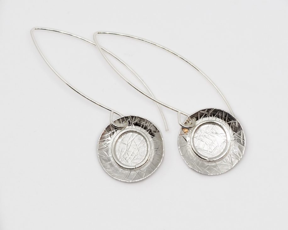 Long Textured Silver Earrings with Circles by ARTYRA Studio at The Avenue Gallery, a contemporary fine art gallery in Victoria, BC, Canada.