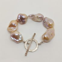 Peach Baroque Pearl Bracelet by Val Nunns at The Avenue Gallery, a contemporary fine art gallery in Victoria, BC, Canada.