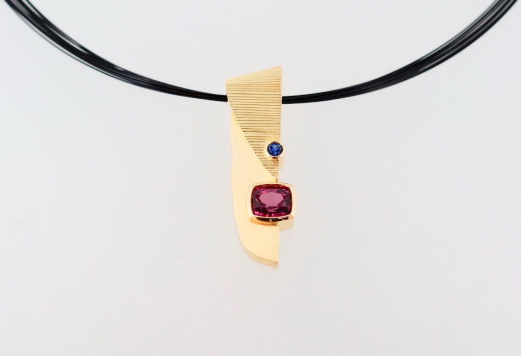 18kt. Yellow Gold Pendant with Rhodolite Garnet, Blue Sapphire & Stainless Steel Wire by Bayot Heer at The Avenue Gallery, a contemporary fine art gallery in Victoria, BC, Canada.