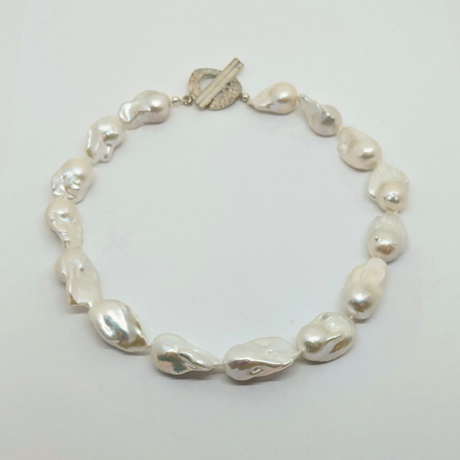 White Freshwater Baroque Pearl Necklace by Val Nunns at The Avenue Gallery, a contemporary fine art gallery in Victoria, BC, Canada.