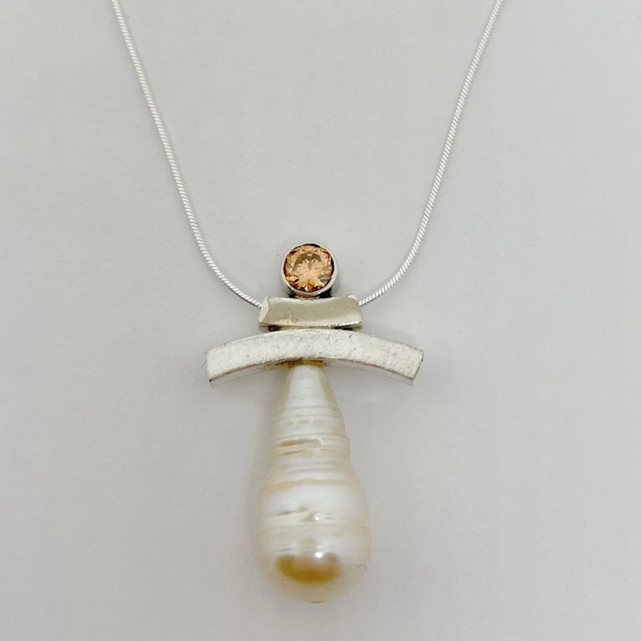 Balance Inukshuk Necklace with Pink Cubic Zirconia and Freshwater Pearl by Chi's Creations at The Avenue Gallery, a contemporary fine art gallery in Victoria, BC, Canada.