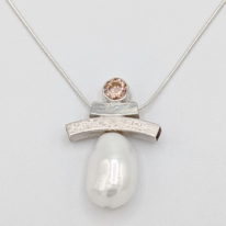 Balance Inukshuk Necklace with Pink Cubic Zirconia & White Freshwater Pearl by Chi's Creations at The Avenue Gallery, a contemporary fine art gallery in Victoria, BC, Canada.