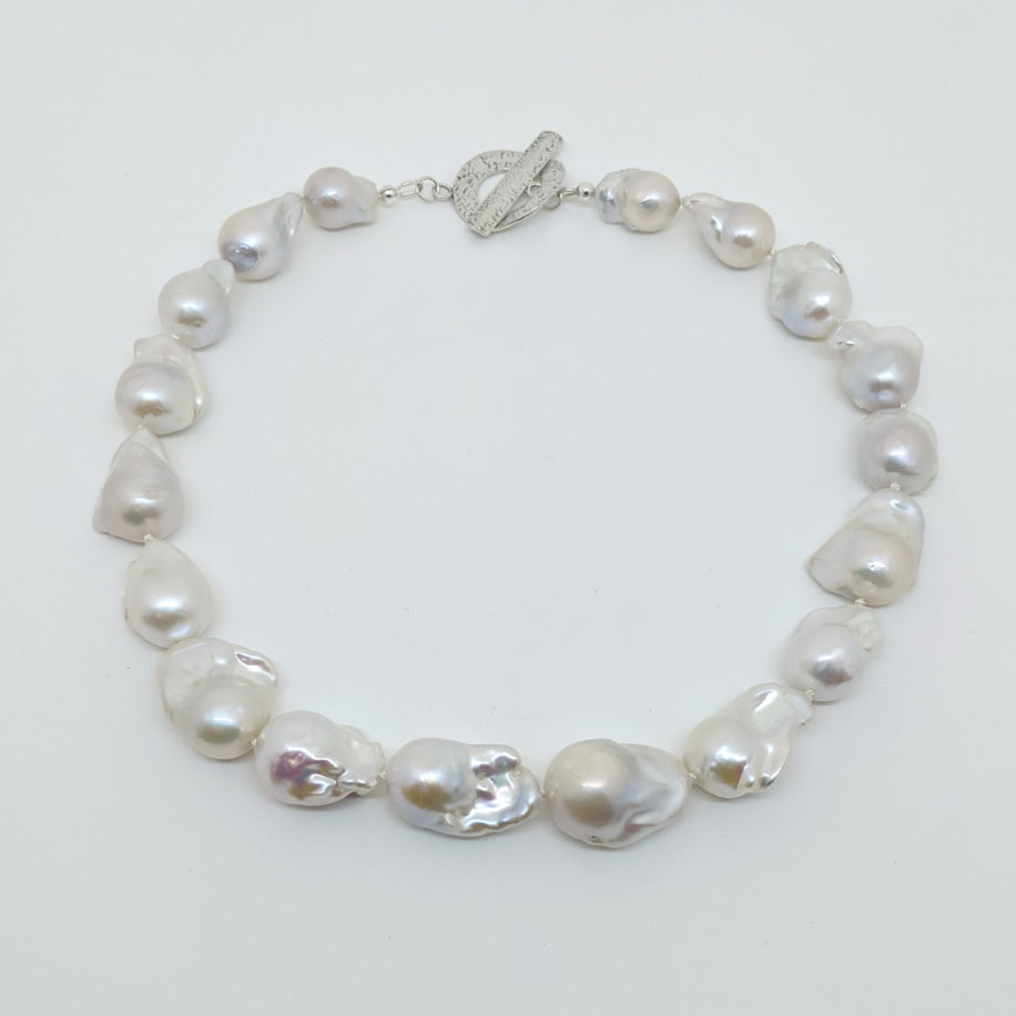 Large White Baroque Pearl Necklace with Large Hammered Toggle Clasp by Val Nunns at The Avenue Gallery, a contemporary fine art gallery in Victoria, BC, Canada.