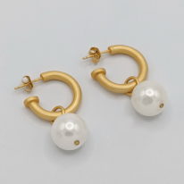 White Round Shell Pearl Earrings on Hoop by Val Nunns at The Avenue Gallery, a contemporary fine art gallery in Victoria, BC, Canada.