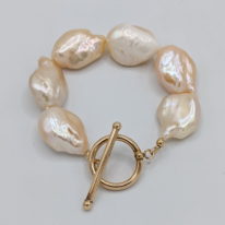 Cream Baroque Pearl Bracelet with Gold-Filled Toggle Clasp by Val Nunns at The Avenue Gallery, a contemporary fine art gallery in Victoria, BC, Canada.