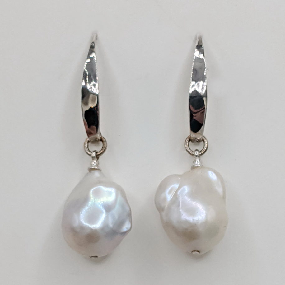 White Baroque Pearl Earrings on Hammered Sterling Silver Wires by Val Nunns at The Avenue Gallery, a contemporary fine art gallery in Victoria, BC, Canada.