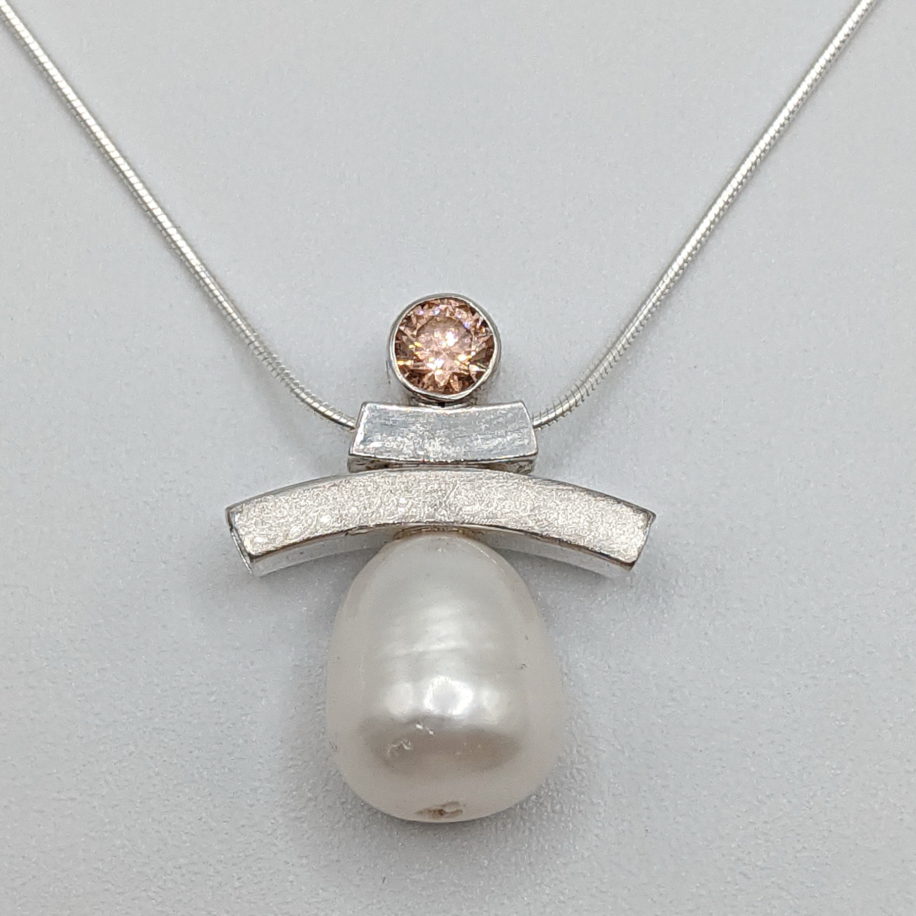 Balance Inukshuk Necklace with Pink Cubic Zirconia & Freshwater Pearl by Chi's Creations at The Avenue Gallery, a contemporary fine art gallery in Victoria, BC, Canada.