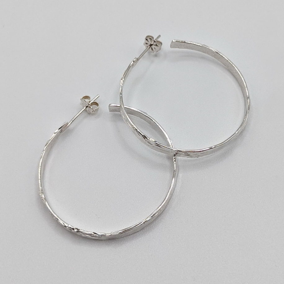 Bark Vertical Hoop Earrings by A & R Jewellery at The Avenue Gallery, a contemporary fine art gallery in Victoria, BC, Canada.