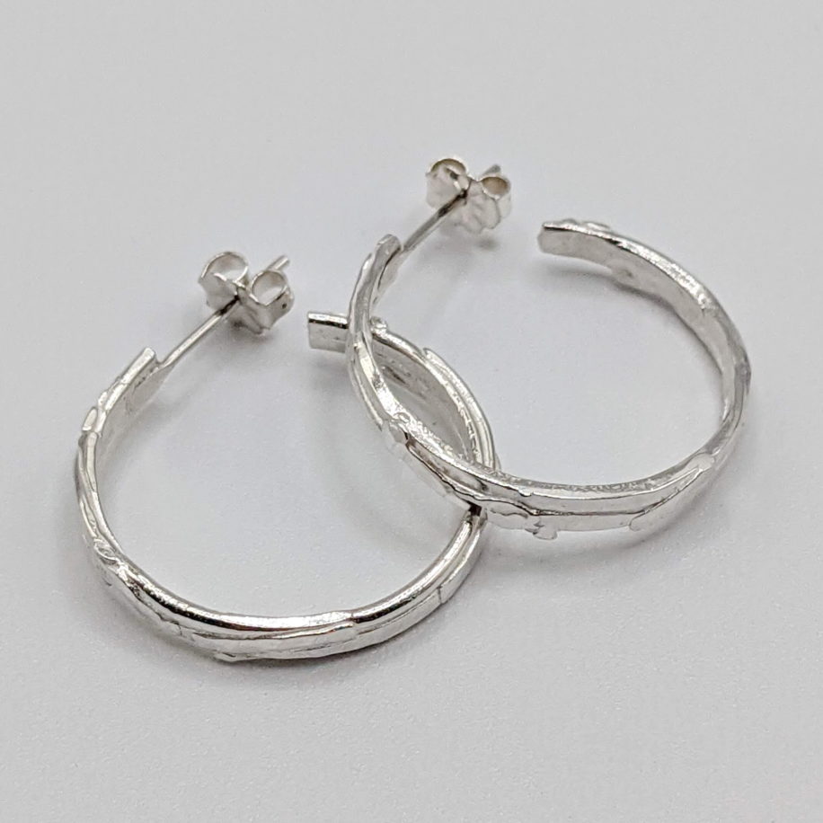 Bark Vertical Hoop Earrings by A & R Jewellery at The Avenue Gallery, a contemporary fine art gallery in Victoria, BC, Canada.