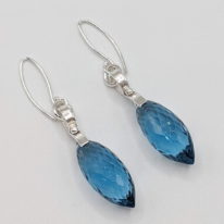 Wave Curl Earrings with London Blue Topaz by A & R Jewellery at The Avenue Gallery, a contemporary fine art gallery in Victoria, BC, Canada.
