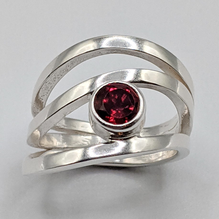 Wind Design Ring with Red Topaz by A & R Jewellery at The Avenue Gallery, a contemporary fine art gallery in Victoria, BC, Canada.