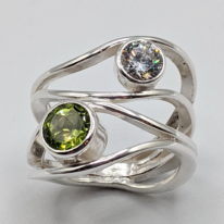 Wind Design Ring with Peridot & Cubic Zirconia by A & R Jewellery at The Avenue Gallery, a contemporary fine art gallery in Victoria, BC, Canada.