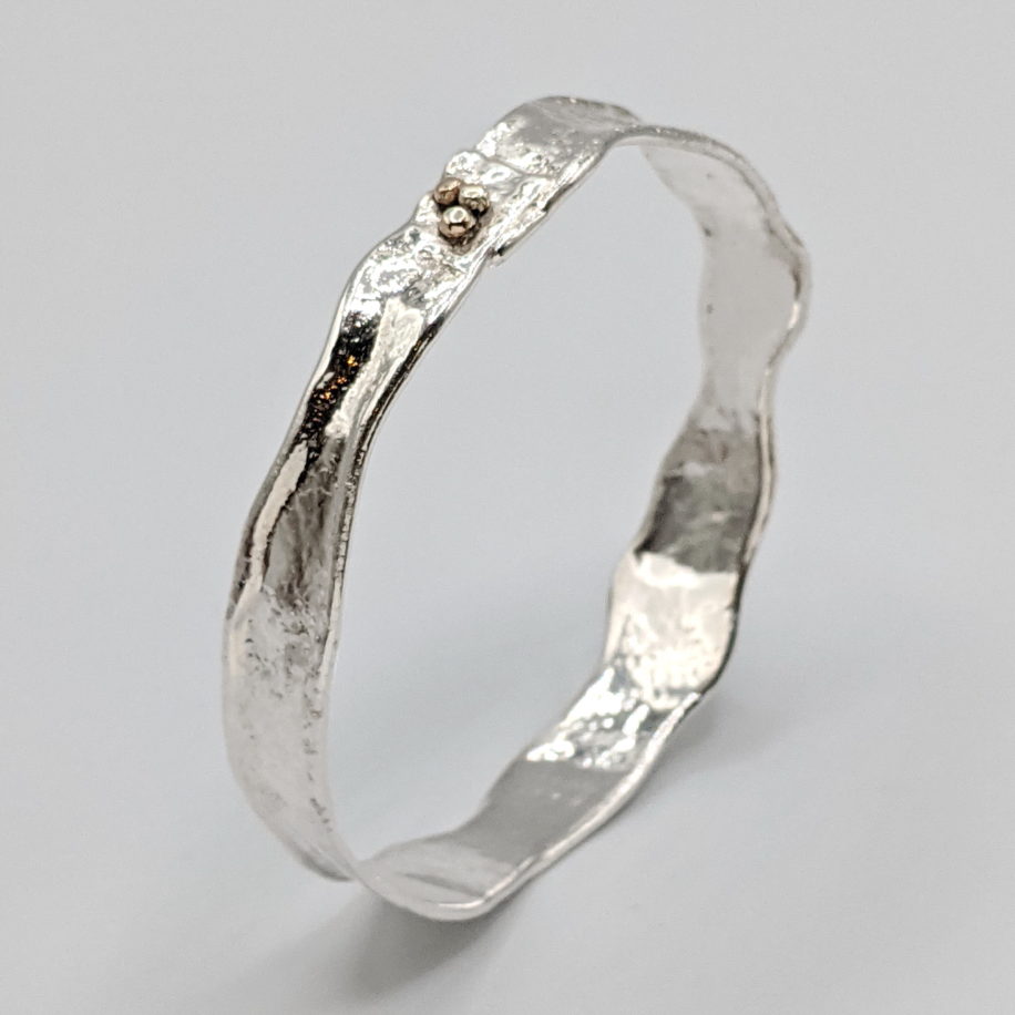 Narrow Reticulated Silver Bangle with 3 Gold Balls by Barbara Adams at The Avenue Gallery, a contemporary fine art gallery in Victoria, BC, Canada.