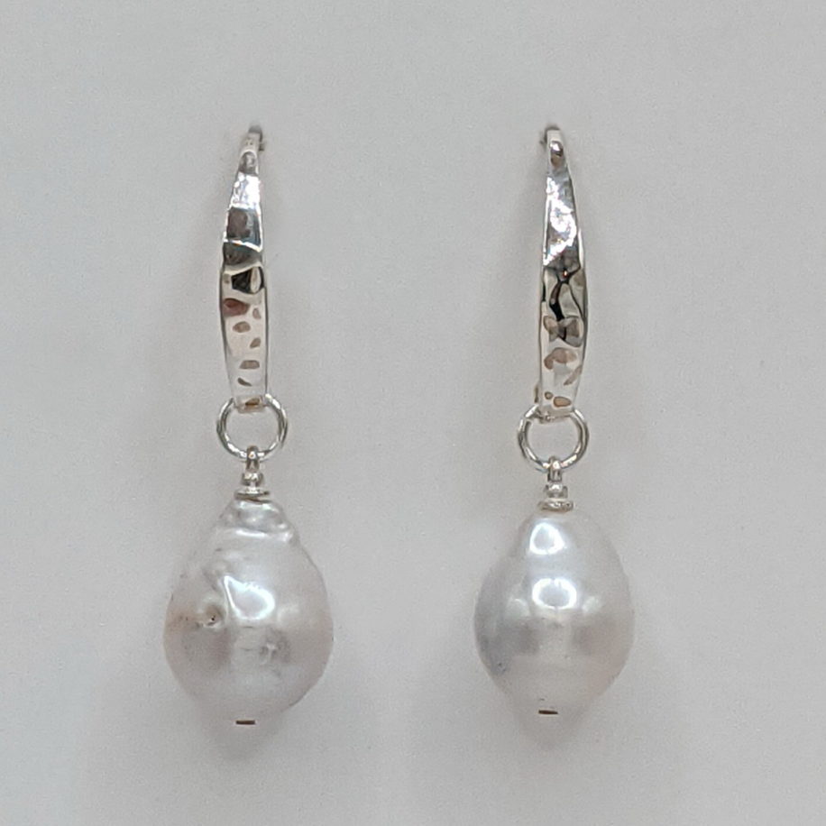 Small White Baroque Freshwater Pearl Earrings with Hammered Sterling Silver Wires by Val Nunns at The Avenue Gallery, a contemporary fine art gallery in Victoria, BC, Canada.