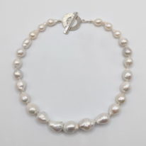 White Baroque Freshwater Pearl Necklace with Hammered Sterling Silver Toggle Clasp by Val Nunns at The Avenue Gallery, a contemporary fine art gallery in Victoria, BC, Canada.