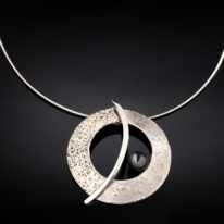 The Balance Orbit Necklace by Chi's Creations at The Avenue Gallery, a contemporary fine art gallery in Victoria, BC, Canada.