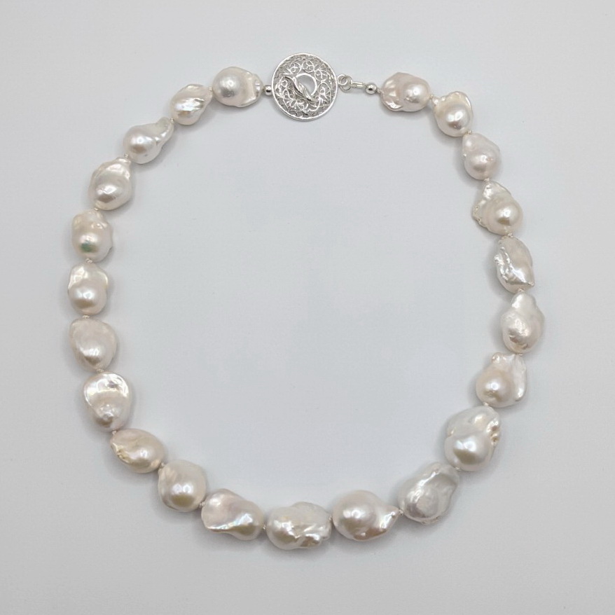 White Baroque Pearl Necklace with Silver Filigree Toggle Clasp by Val Nunns at The Avenue Gallery, a contemporary fine art gallery in Victoria, BC, Canada.