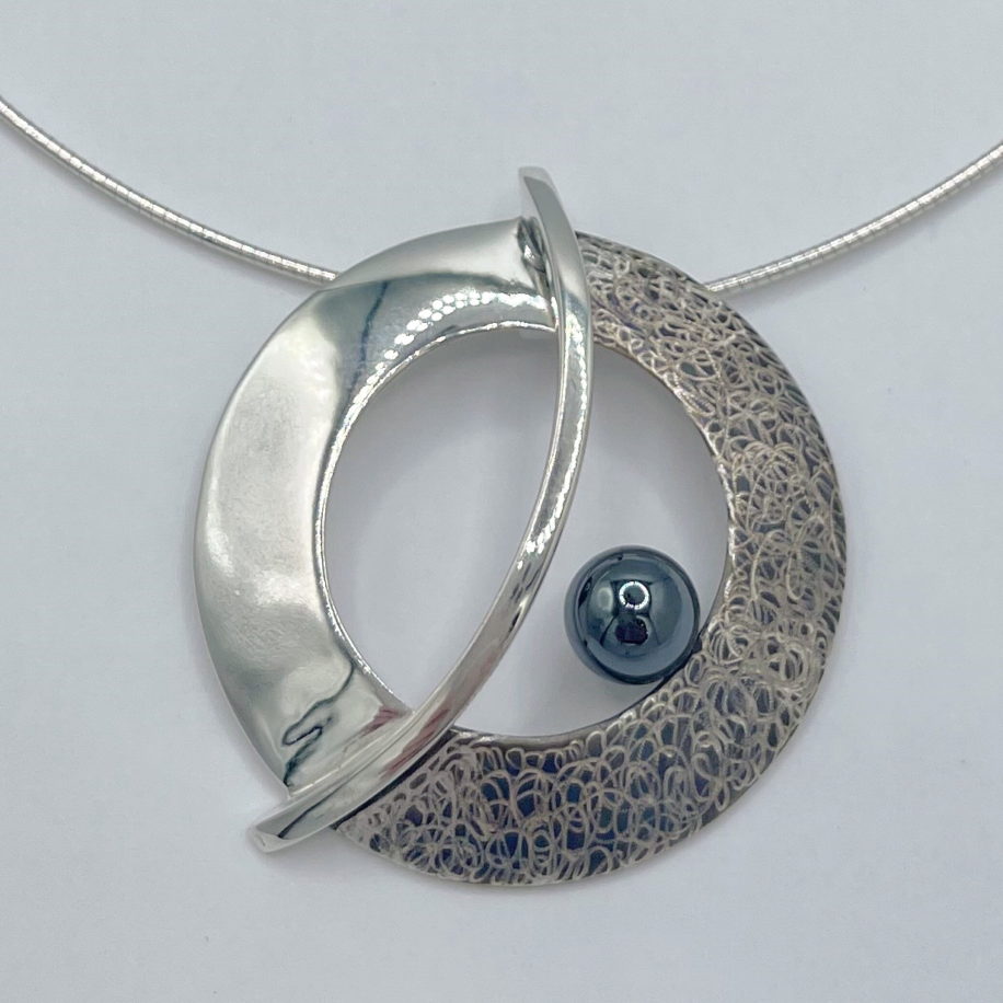 The Balance Orbit Necklace by Chi's Creations at The Avenue Gallery, a contemporary fine art gallery in Victoria, BC, Canada.