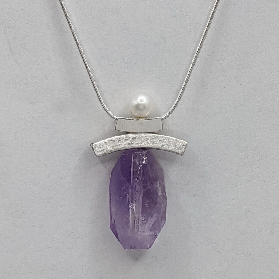Inukshuk Necklace with Amethyst Crystal by Chi's Creations at The Avenue Gallery, a contemporary fine art gallery in Victoria, BC, Canada.