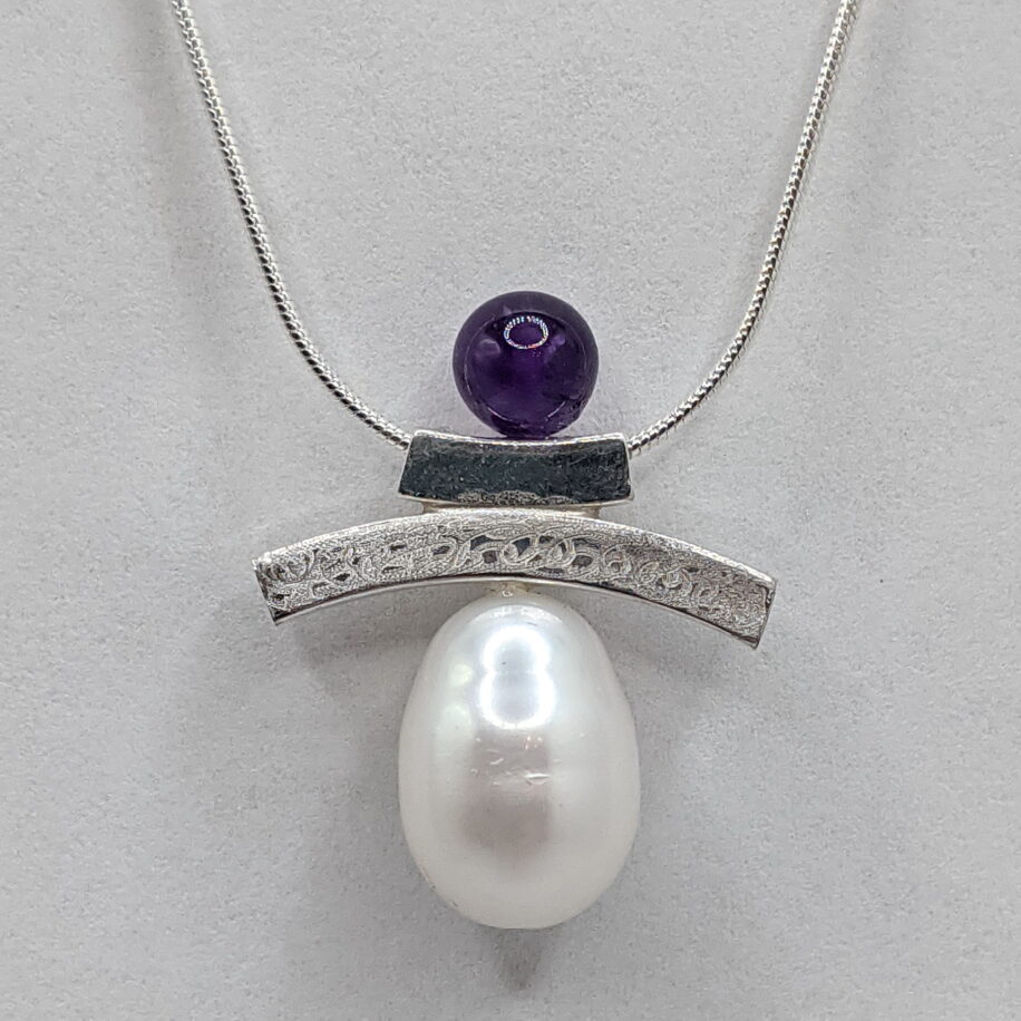 Inukshuk Necklace with Amethyst & Baroque White Pearl by Chi's Creations at The Avenue Gallery, a contemporary fine art gallery in Victoria, BC, Canada.