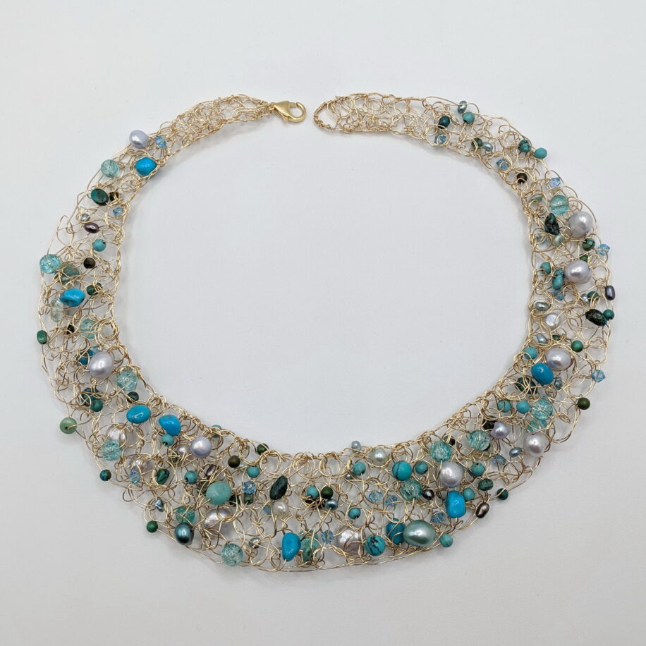 Crocheted Gold-Fill Wire Collar with Turquoise, Blue Pearls & Blue Swarovski Crystals by Veronica Stewart at The Avenue Gallery, a contemporary fine art gallery in Victoria, BC, Canada.